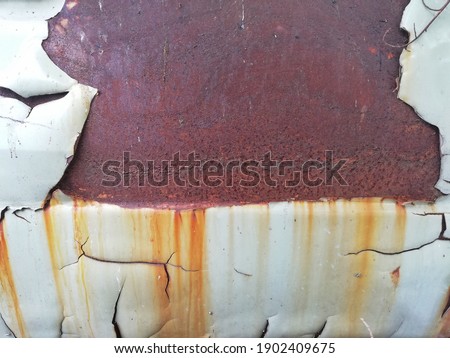 Rust has formed on the iron of an abandoned car body. Rust is formed when iron or some alloys containing iron are exposed to oxygen and moisture for a long time.