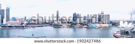 Singapore skyline. Amazing aerial panoramic view of Marina Bay area with tall skyscrapers