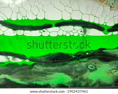 panel with water, green oil and sand
