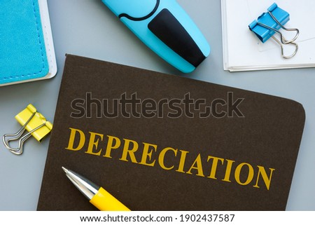 Book about Depreciation and pen on the table. Royalty-Free Stock Photo #1902437587