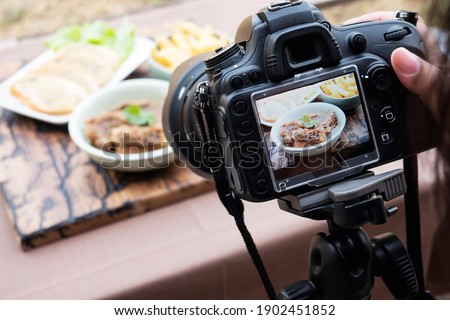 People using digital camera taking food photograph or video product