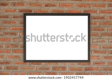Empty frame picture on the brick wall background