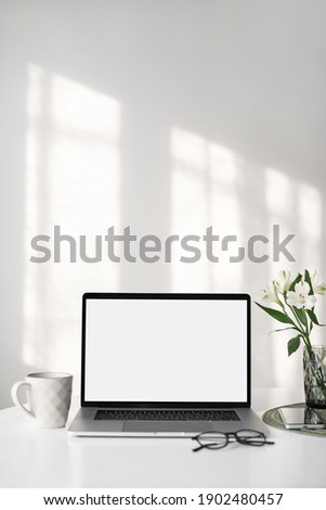 Workplace, laptop computer with blank empty white screen display monitor on desk. Mock up, copy space. Home office concept. Business, working from home, studying, e-learning, web site concept Royalty-Free Stock Photo #1902480457