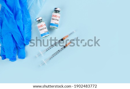 Covid-19 Corona Virus 2019-ncov vaccine vials medicine drug bottles syringe injection. Vaccination, immunization, treatment to cure Covid 19 Corona Virus infection. Medicine infectious concept.