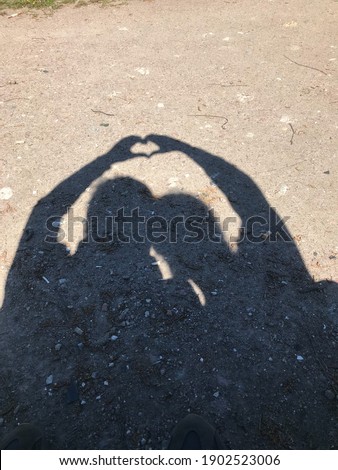 Shadow of two people in love