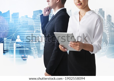 Unrecognizable businesswoman and businessman working in blurry city with double exposure of social network interface. Concept of recruitment. Toned image