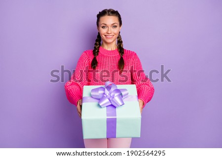 Photo of young beautiful happy positive cheerful girl give you box present gift isolated on violet color background