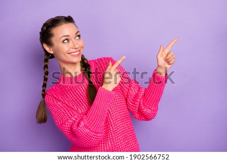 Photo of young attractive beautiful happy positive girl point finger copyspace advertisement isolated on violet color background