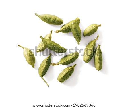 Cardamom pods isolated on white background top view Royalty-Free Stock Photo #1902569068
