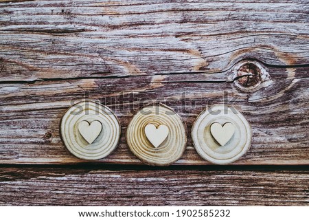 Wooden hearts on a vintage wood texture background and empty space