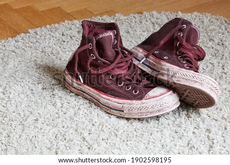 Dirty used shoes on carpet