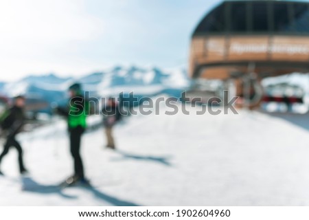snowy landscape and snowboarders unfocused background. winter extreme sport view