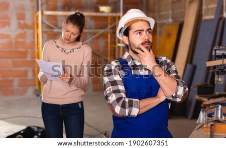 Foreman unpleasantly surprised by the work of the builders. High quality photo