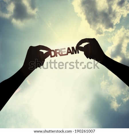 holding a dream in sky Royalty-Free Stock Photo #190261007
