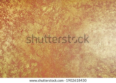 Gloden concrete wall texture background.