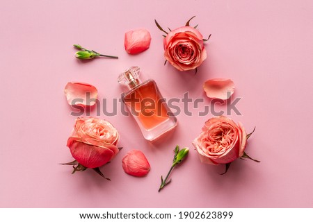 Perfume luxury bottle fragrances with roses. Top view