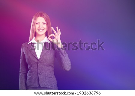 Beautiful woman inviting for shopping, shows ok sign, black friday, sales concept.