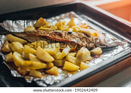Homemade food, fish mackerel baked with potatoes