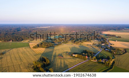 Panoramic view of the countryside town of Skinnarby, Finland. The railroad crossing the field.
