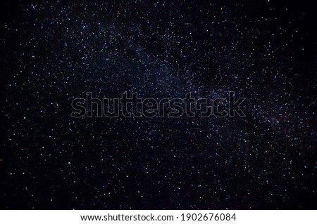 Dark night sky Milky Way and stars on a dark background. Starry sky over Chelyabinsk region, Russia Royalty-Free Stock Photo #1902676084