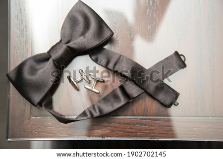  Groom's bow tie with tie clips detail wedding photo. Royalty-Free Stock Photo #1902702145