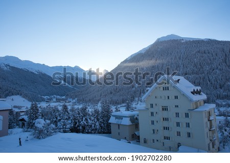 Beautiful and freezing sunrise after heavy snowfall in the Swiss Mountains Alps at Davos . High quality photo