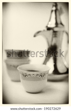 Arabic coffee mugs and kettle - grainy black and white photo effect