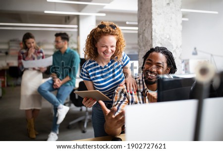 Group of business people and software developers working as a team in office Royalty-Free Stock Photo #1902727621