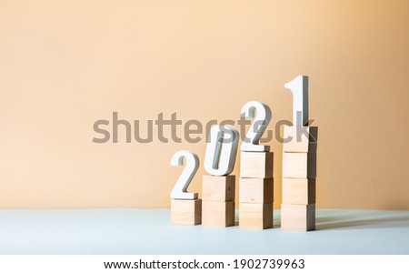 2021 text mock up on wood step on color pastel background.