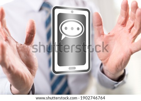 Message concept between hands of a man in background