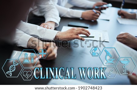 Medical healthcare concept - group of doctors in hospital with digital medical icons, graphic banner showing symbol of medicine, providing medical care. The inscription "CLINICAL WORK" 
