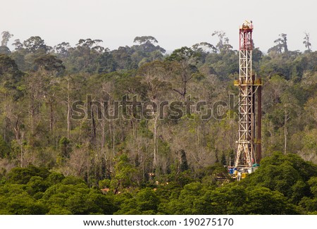 Drilling rig in a tropical jungle  Royalty-Free Stock Photo #190275170