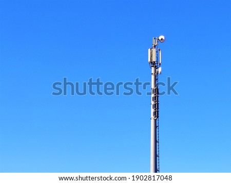Telecommunication tower of 4G and 5G cellular.  Wireless Communication Antenna Transmitter. Telecommunication tower with antennas against blue sky background.
