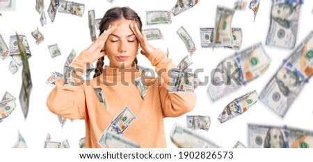 Beautiful caucasian woman with blonde hair wearing casual winter sweater with hand on head for pain in head because stress. suffering migraine.