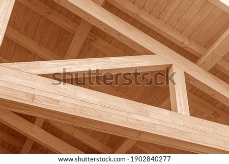 Wooden roof structure. Glued laminated timber roof. Rafters made of wood. Royalty-Free Stock Photo #1902840277