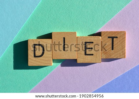 Diet, word in wooden alphabet letters isolated on colourful background