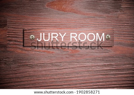 "Jury Room" sign on the wooden door of the court house. Royalty-Free Stock Photo #1902858271