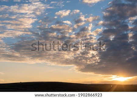 dawn orange with blue sky and clouds with copy space