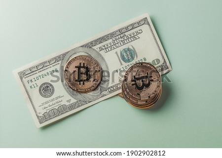 The bitcoin coin is on the dollar. High quality photo
