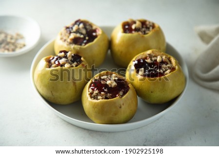 Homemade roasted apples with jam and nuts