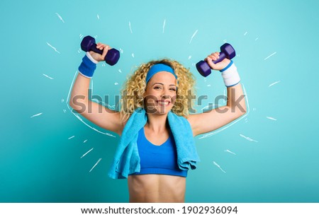 Girl trains with handlebars. cyan color background