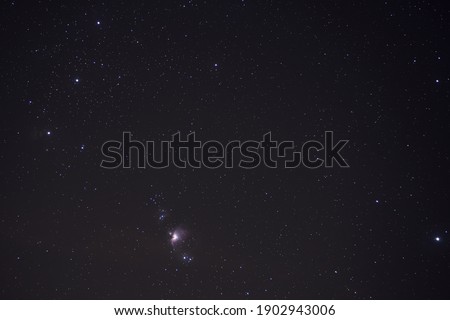Universum with Orion nebula in the night.