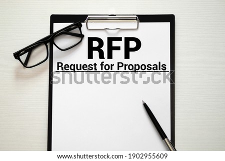 RFP- Request For Proposal written in notebook. Royalty-Free Stock Photo #1902955609
