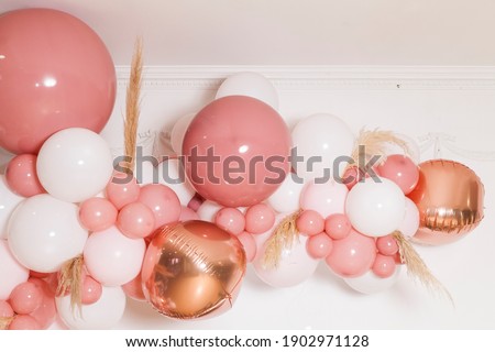 Arch of pink and white balloons; Birthday party decoration for a girl.
