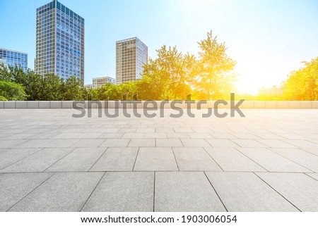 Empty square floor and modern city commercial buildings in Beijing,China.