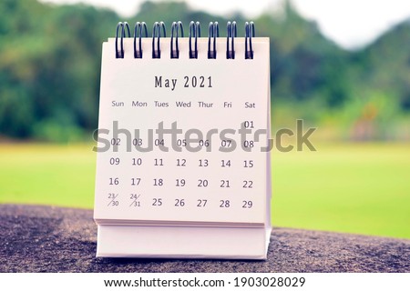 May 2021 white calendar with green blurred background. 2021 new year concept Royalty-Free Stock Photo #1903028029