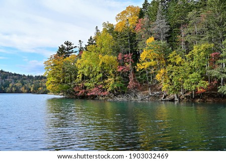 Scenery of the Lake Onneto near  campsite with autumn leaves which are best time to see at Hokkaido 