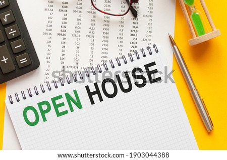 Writing text showing OPEN HOUSE. Writing text OPEN HOUSE on white paper card, green and black letters, yellow background. Business concept.