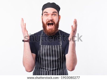 Photo of chef man looking amazed at the camera