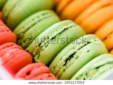 Close up Cake macaron or macaroon background from above, colorful almond cookies, colorful background many tasty.macarons as background.Matcha Green tea flavor.Sweet and dessert biscuit from france.